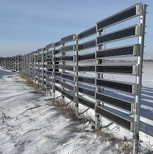 photo of fence made of narrow solar panels